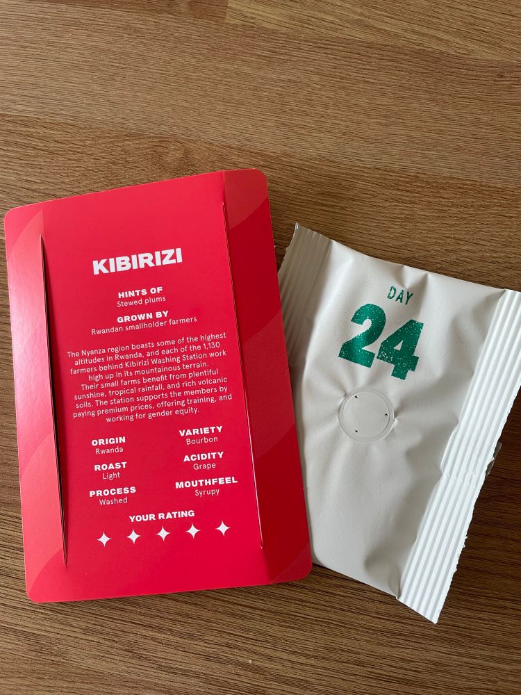 A red card with a single serving sachet of coffee. The card reads: KIBIRIZI
HINTS OF
Stewed plums
GROWN BY
Rwandan smallholder farmers
The Nyanza region boasts some of the highest altitudes in Rwanda, and each of the 1,130 farmers behind Kibirizi Washing Station work high up in its mountainous terrain.
Their small farms benefit from plentiful sunshine, tropical rainfall, and rich volcanic soils. The station supports the members by paying premium prices, offering training, and working for gender equity.
ORIGIN
Rwanda
VARIETY
Bourbon
ROAST
Light
PROCESS
Washed
ACIDITY
Grape
MOUTHFEEL
Syrupy