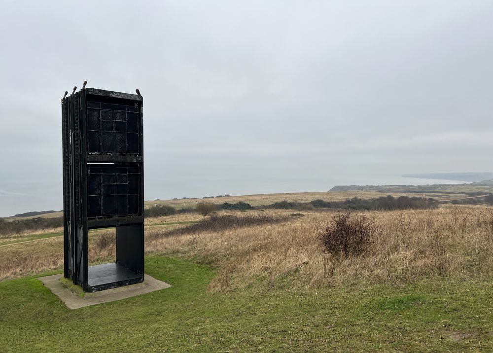 Lift cage from Easington Colliery with a hazy sea in the background 