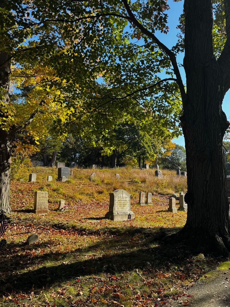 A historic New England cemetery (Hingham Cemetery) on a sunny fall day
