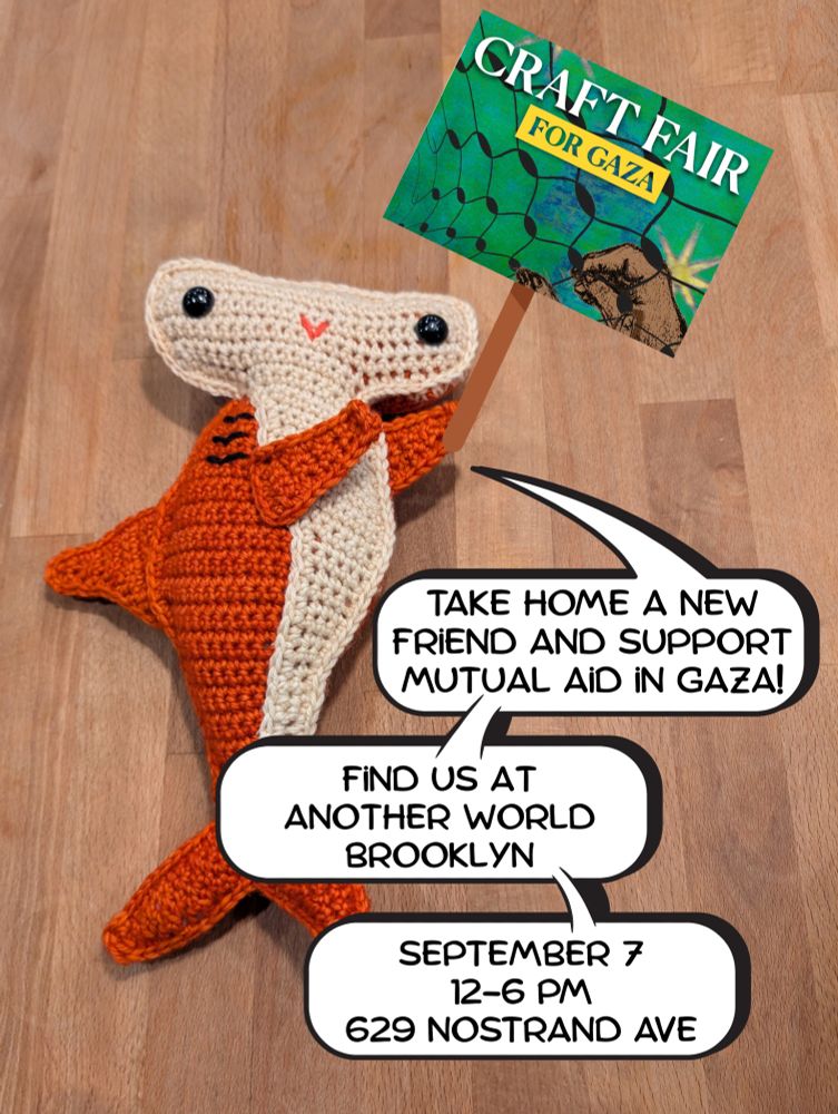 A crocheted orange and white shark holds a small sign that reads "Craft Fair for Gaza." Speech bubbles provide event details: September 7, 12–6 PM, 629 Nostrand Ave, Brooklyn; fundraiser for mutual aid in Gaza.