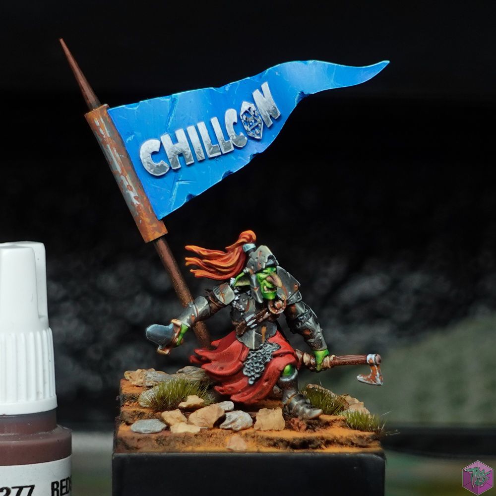An armoured Goblin with a banner behind, displaying the Chillcon logo