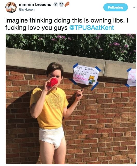 Tweet with a picture of Charlie Kirk in a diaper at a university protest 