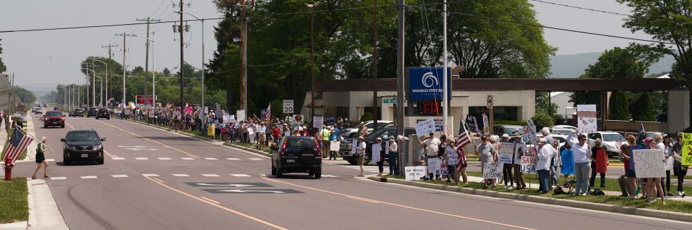 NO KINGS Protesters enthusiastically but peacefully line the street in Baraboo Wisconsin