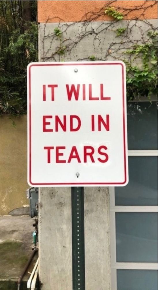 Road side that says “it will end in tears”