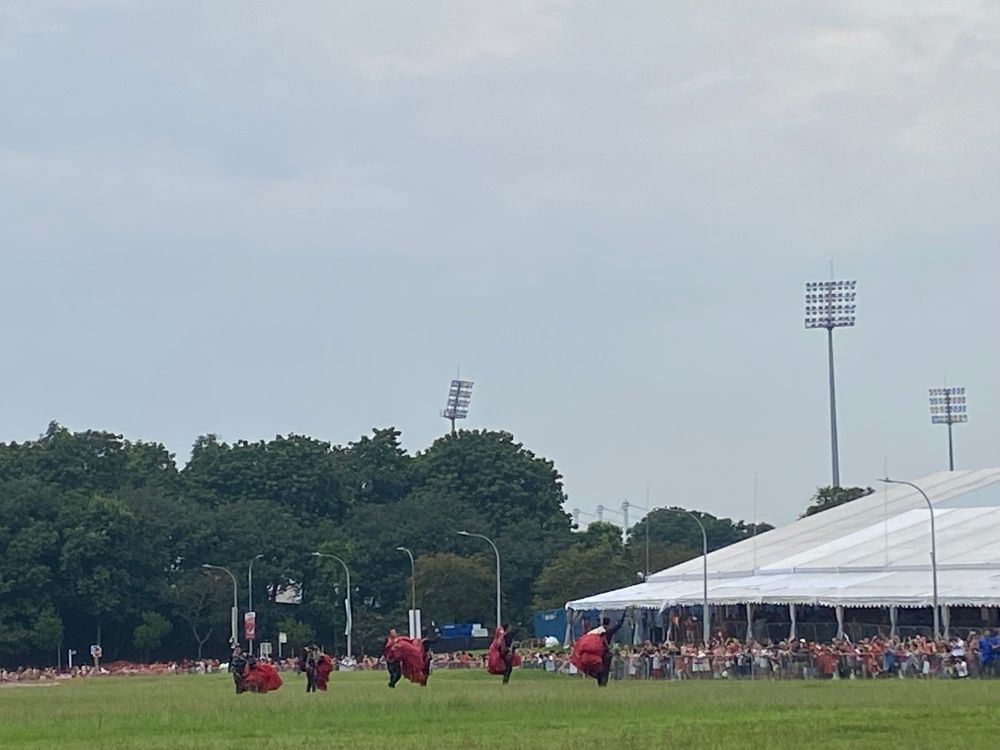 After the land, when the Red Lions waved to those at the Central Singapore National Day Heartland Celebrations in Bishan at the open field which they landed on.