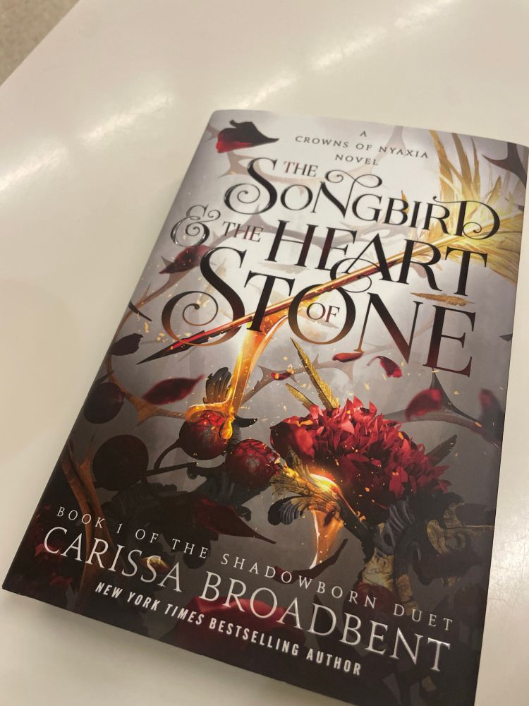 Photo of the book The Songbird and the Heart of Stone by Carissa Broadbent.
