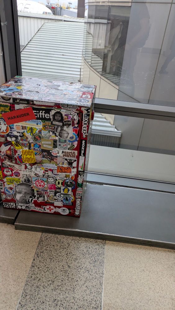 a lock box covered in cool stickers
