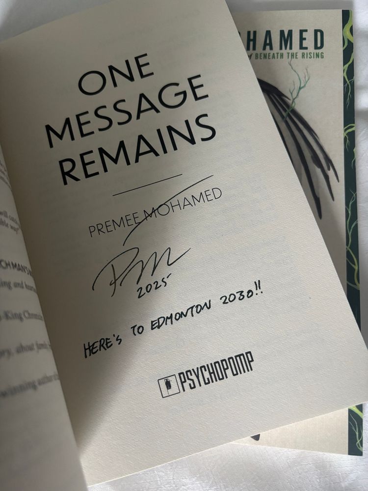 Signed books - one message remains by Premee Mohamed inscribed with Here’s To Edmonton 2030!
