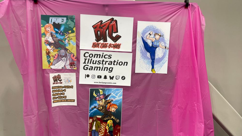 A pink backdrop with posters and art prices 
