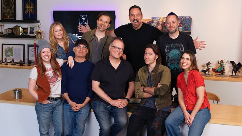 Chris Perkins and Jeremy Crawford pose for a picture with the cast of Critical Role.