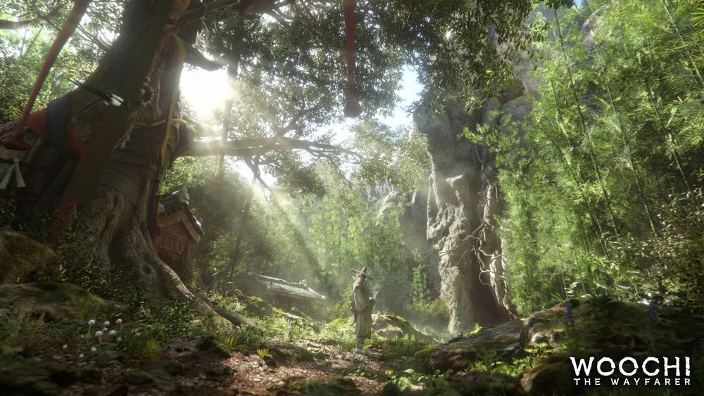 The key art for Woochi the Wayfarer. It shows a man in traditional Korean garb standing in a green and sunlit forest. There is a building, possibly abandoned, in the background. In the bottom right corner, the Woochi the Wayfarer logo insignia resides. 