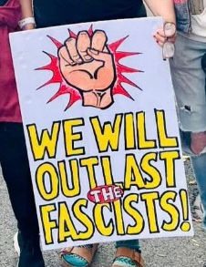 “We will outlast the fascists!”
 A clenched fist is above the words   