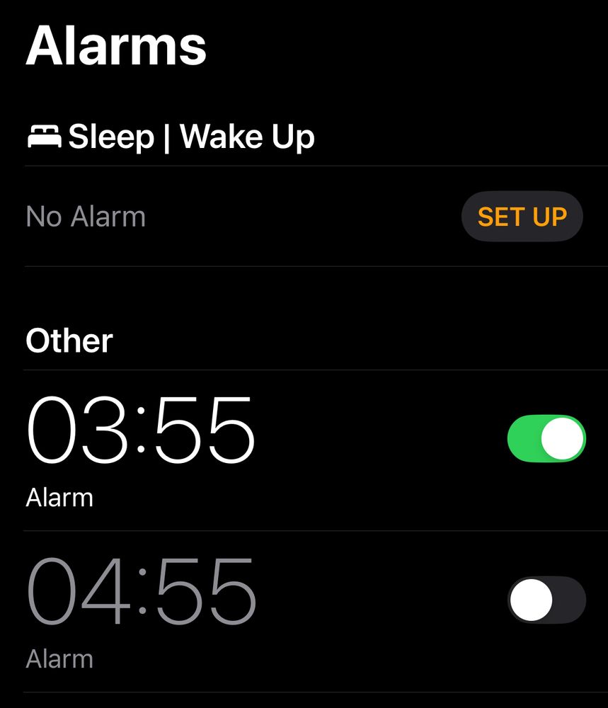 iPhone alarm clock setting with 0355 alarm active and several others inactive