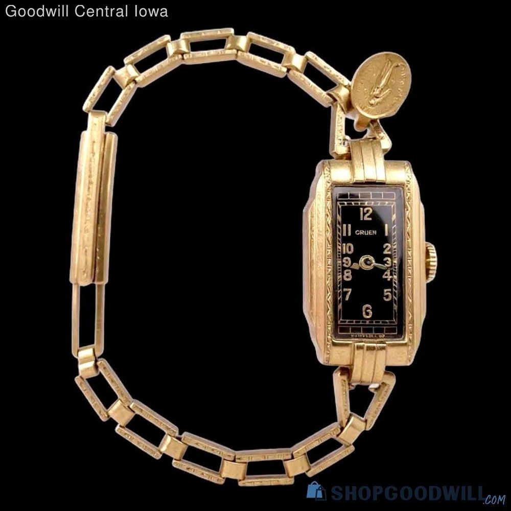 gold and black art deco watch