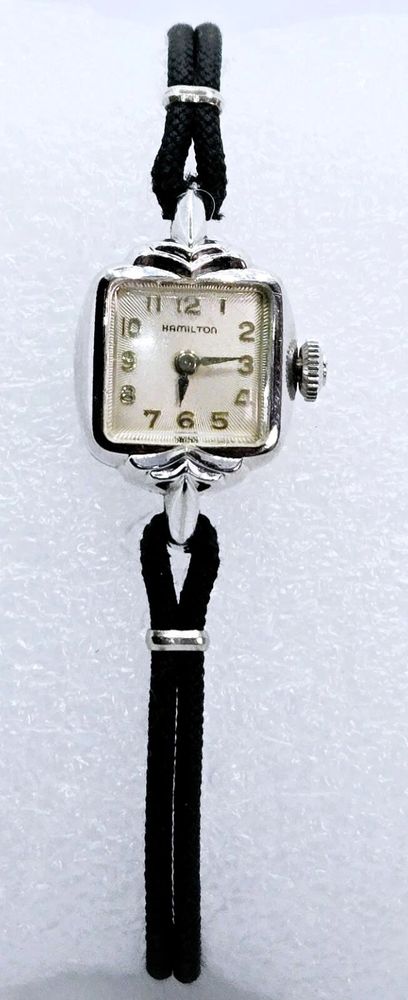 white gold and black art deco watch