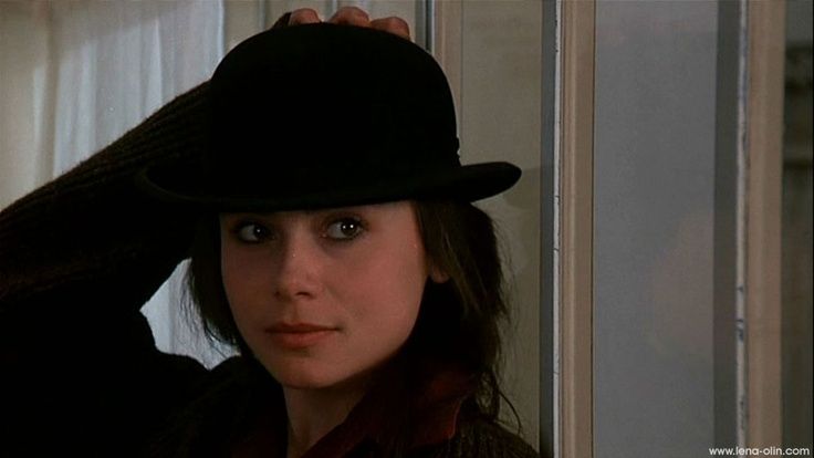 Lena Olin wearing a bowler hat