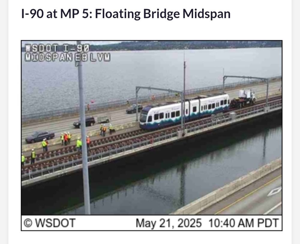 I-90 floating bridge midspan shows a train being pulled by truck