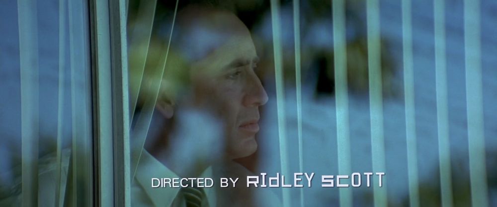 Screenshot from Matchstick Men (2003)

Nicolas Cage looking out a window
Text says “directed by Ridley Scott“