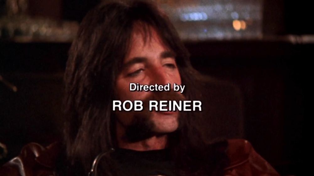 Screenshot from the credits of This is Spinal Tap (1984)
Harry Shearer as Derek Smalls
Text reads « directed by Rob Reiner »