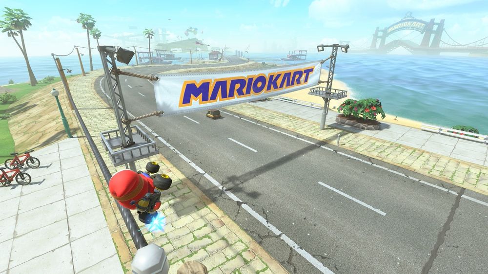 Mariokart World screenshot, banner of Mariokart logo in blue, outlined in yellow