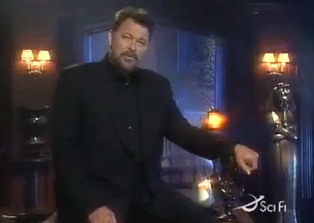 Jonathan Frakes asks you questions in a black suit on "Beyond Belief: Fact or Fiction?" surrounded by spooky 