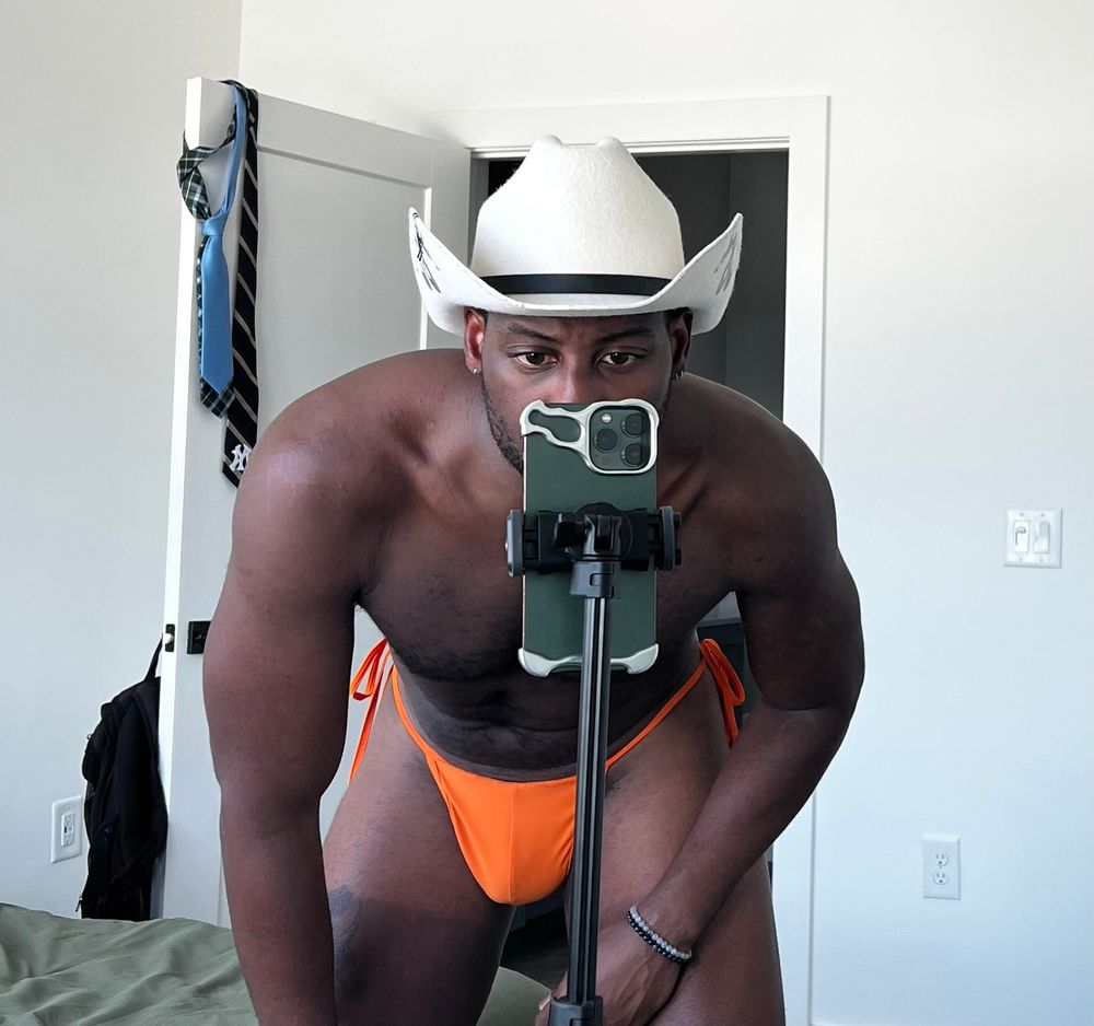 me in a cowboy hat and On Tracks tangerine bikini thong