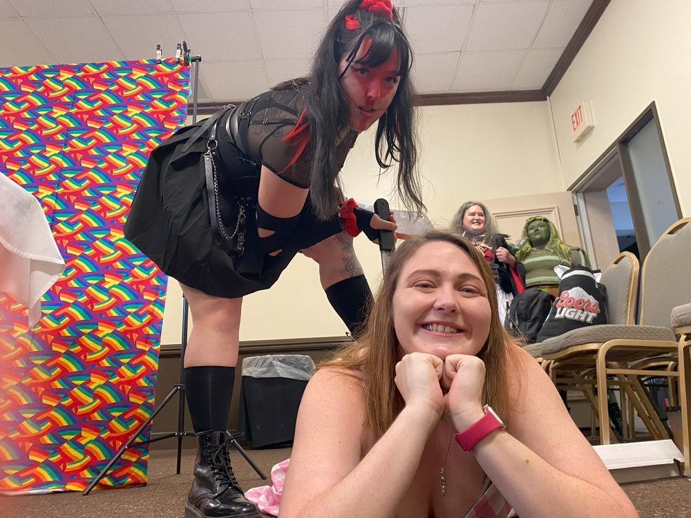 Davy dressed as Massacre Girl stepping on a very happy Misha