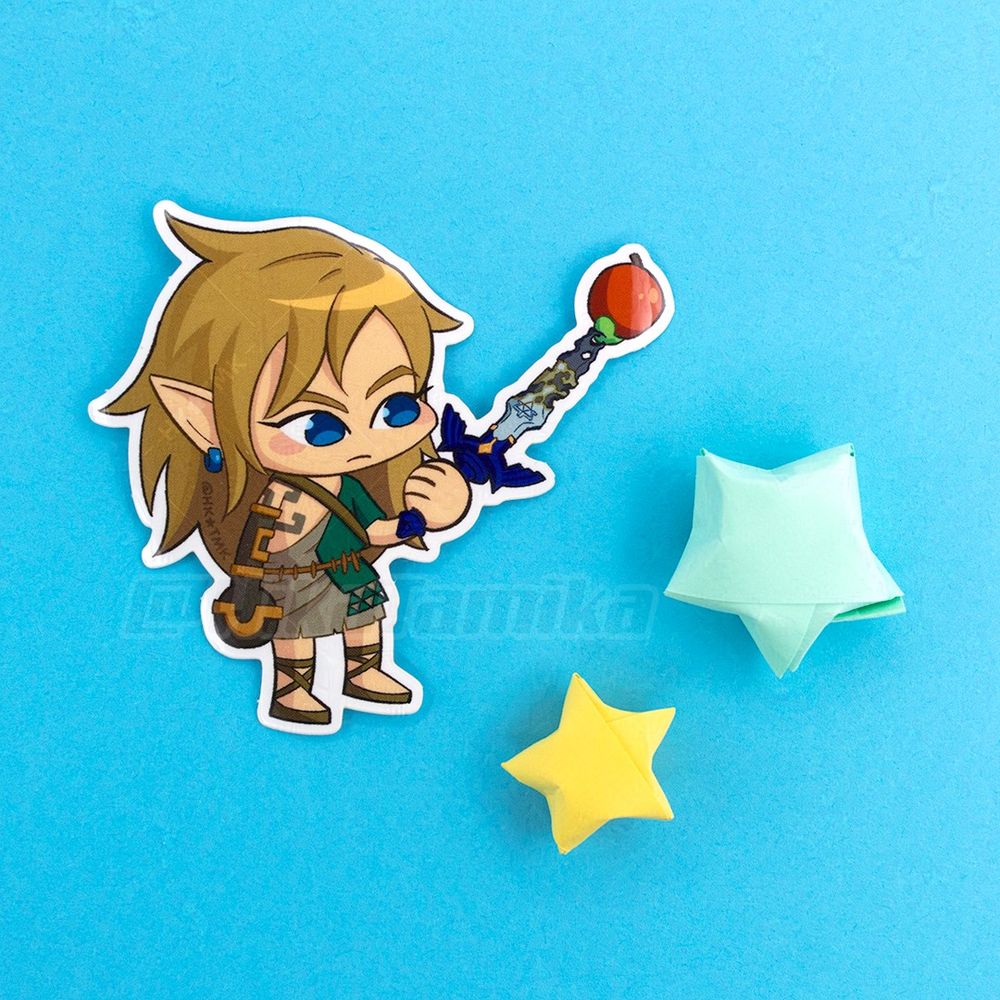 Sticker of Link from tears of the kingdom, with an apple affixed to his busted master sword using the fuse mechanic.