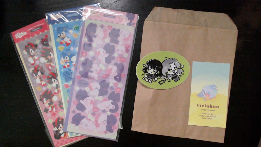Sonic, Shadow and kitty sticker sheets next to a The Guy She Was Interested In… sticker.