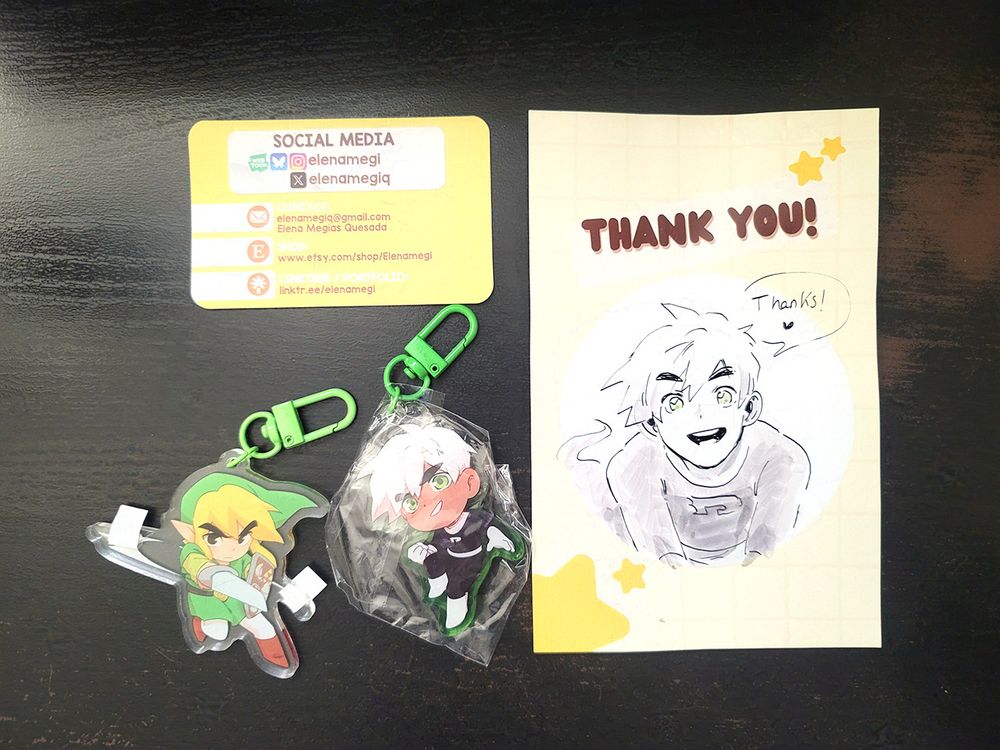 A flat-lay of keychains from Elenamegi! There's a Toon Link keychain and a Danny Phantom one too.