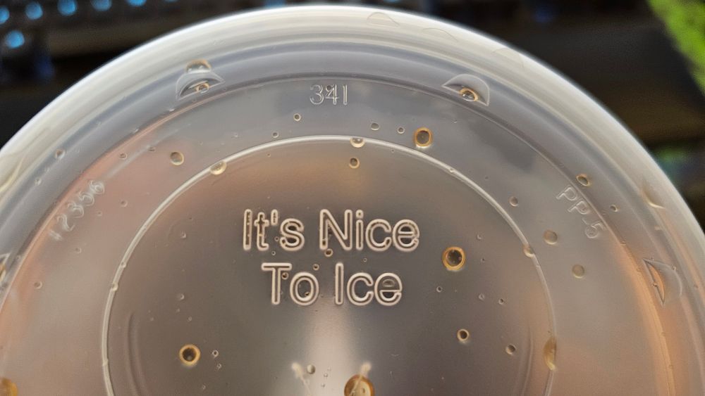 Boot licking McDonald's cup top that says "it's nice to ice."