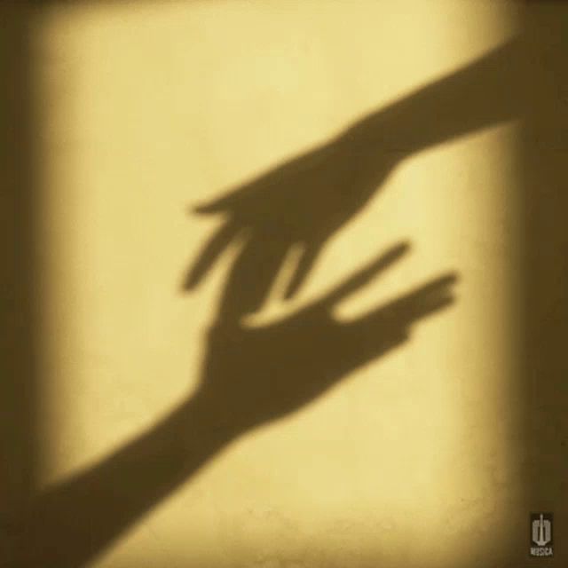 a shadow of a hand reaching out towards another hand with the word musica in the corner