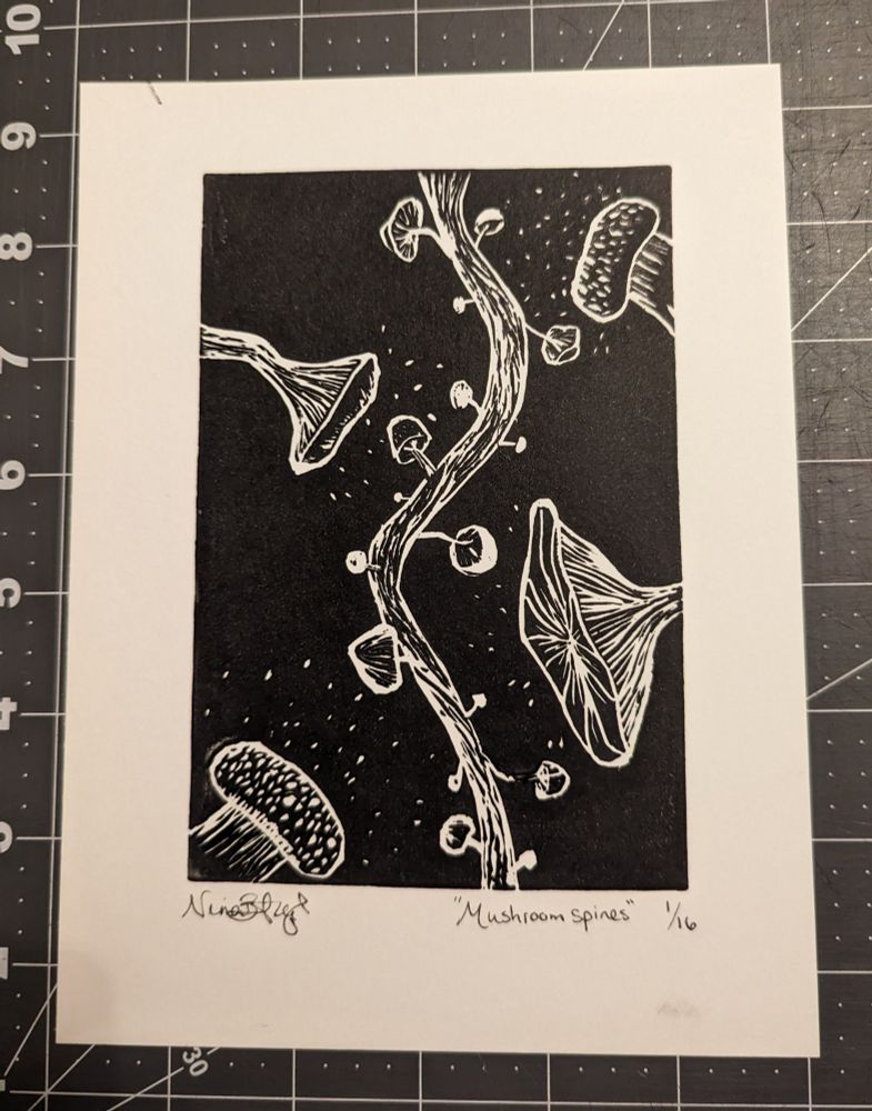 Linocut print meant to resemble a microscopy image of dendritic spines, where the spines are all various mushrooms. 