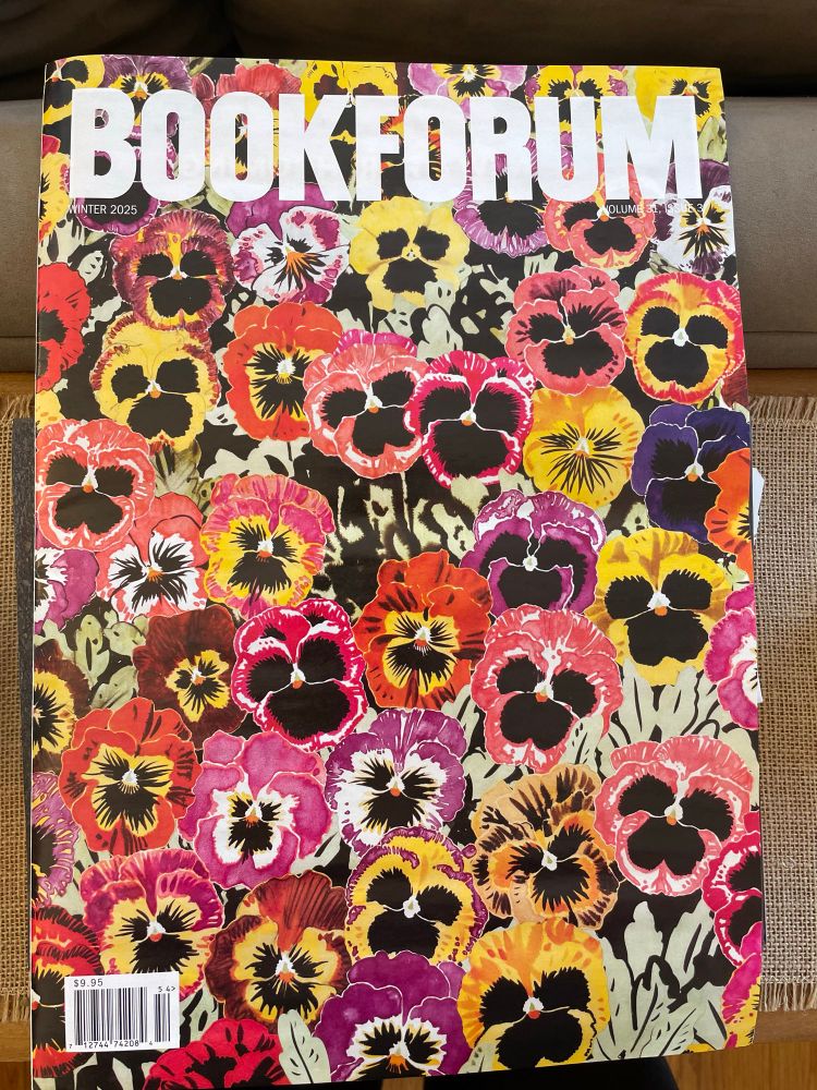 The cover of the new issue of Bookforum, which is full of pink, yellow, and purple pansies. 