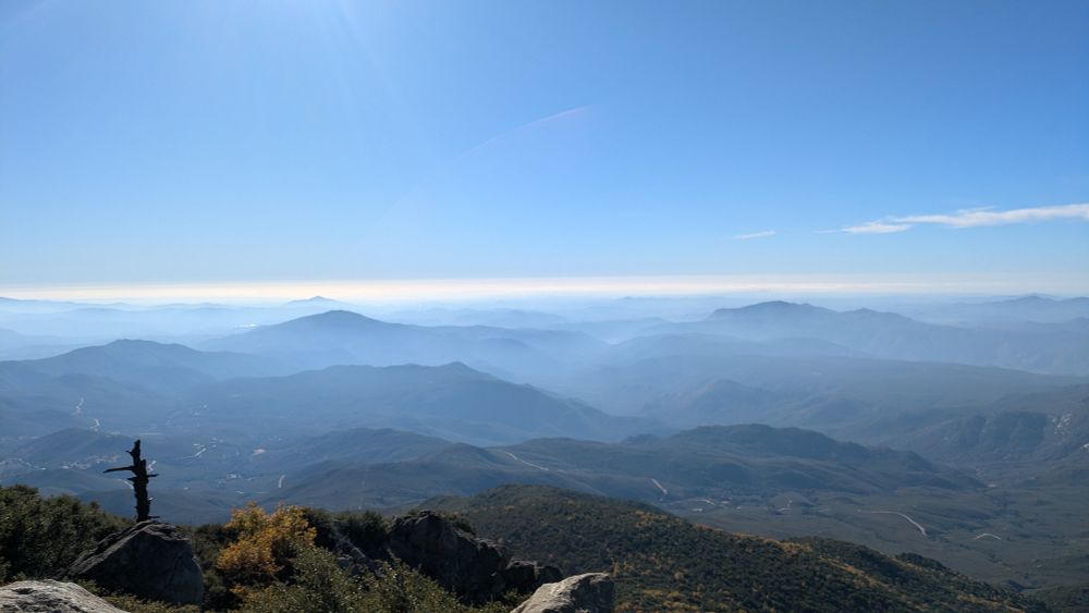 Mountains viewed from above with haze in between
