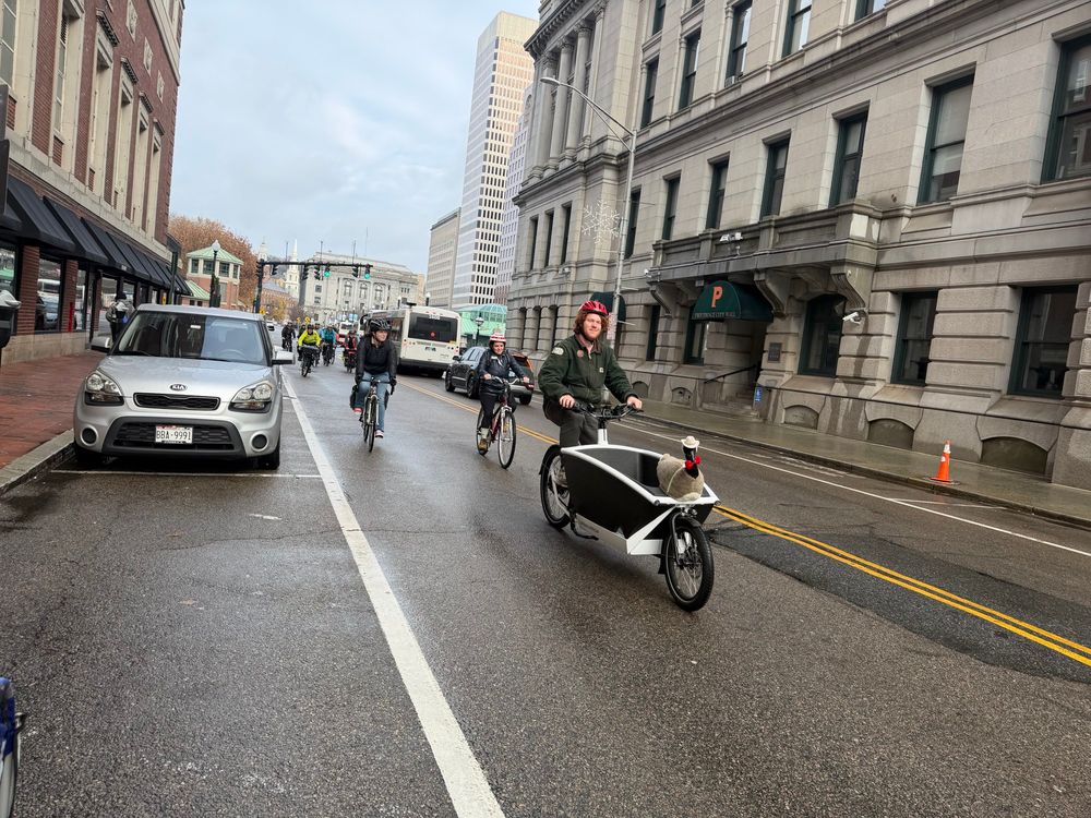 Folks biking up Washington st 