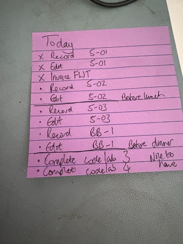 A purple post it listing tasks to be done today. Lots of recording and editing and writing. 
