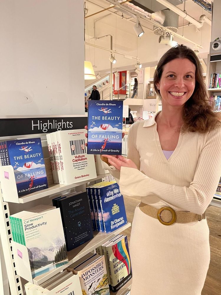 Claudia de Rham with her book, The Beauty of Falling: A Life in Pursuit of Gravity