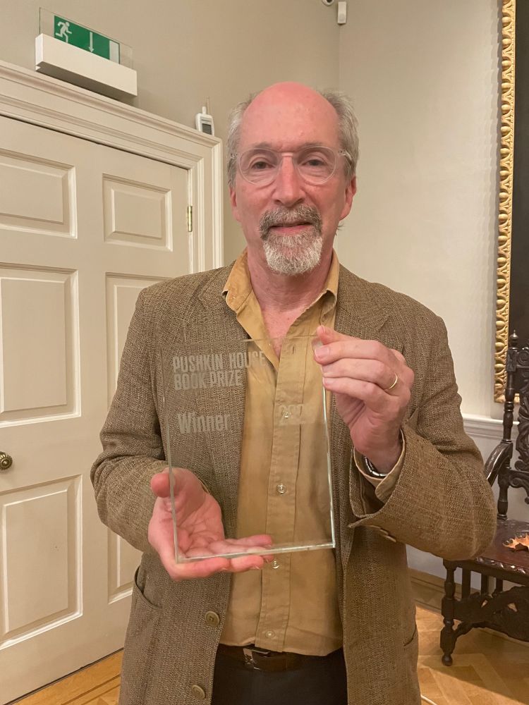 Benjamin Nathans holding prize