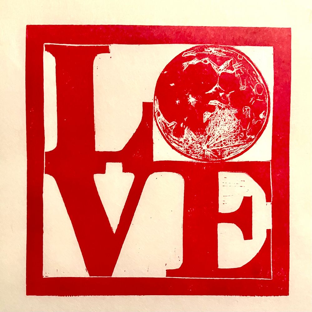 A linocut print in red ink of the word love, in the style of the famous sculpture by Robert Indiana, where the “o” is a full Moon