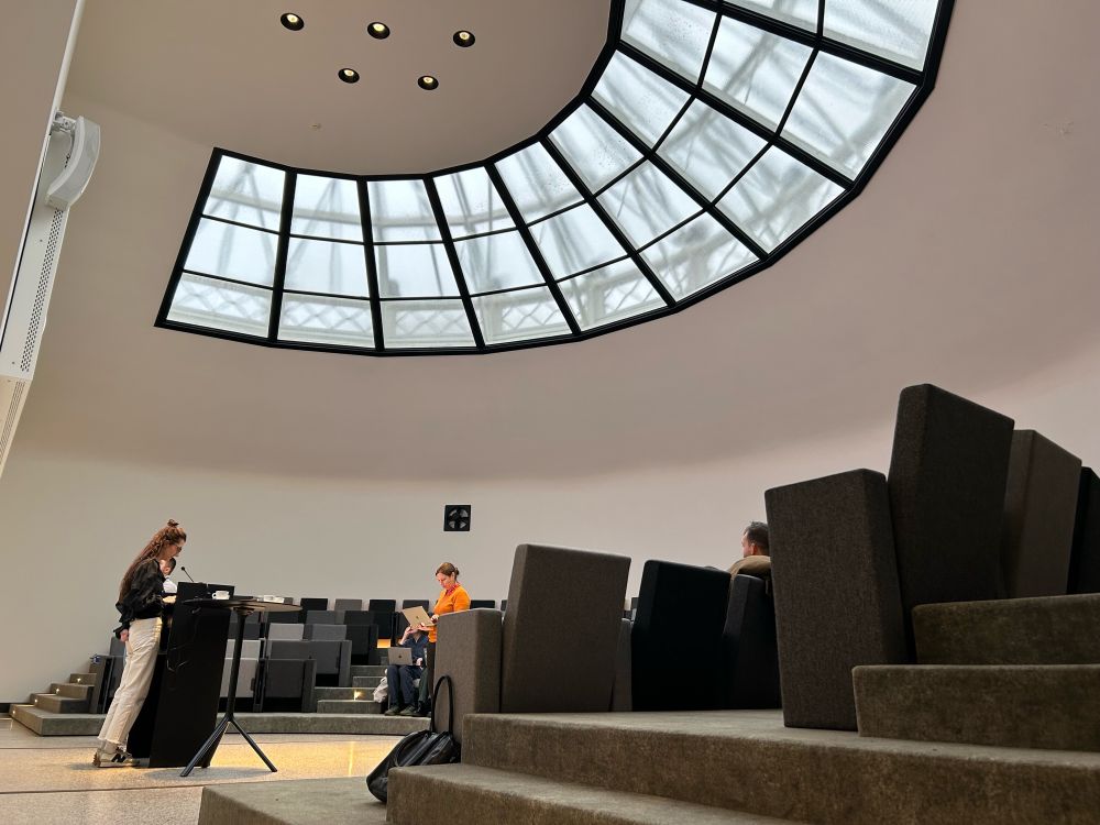 Photo of the former anatomical theatre with speakers testing their slides.