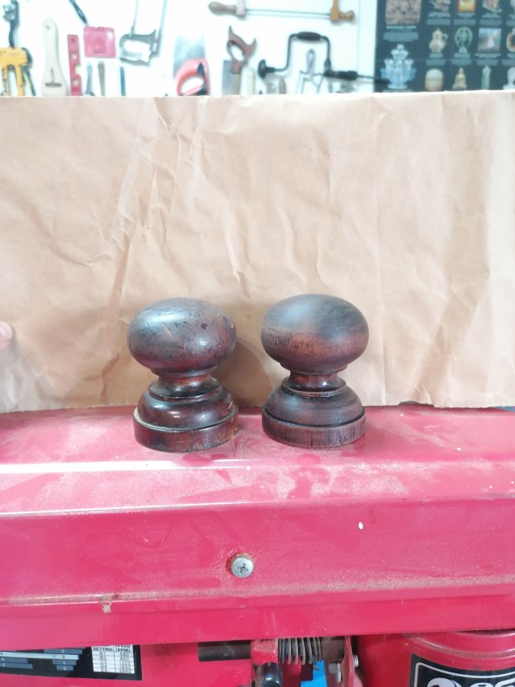 Two turned mahogany furniture knobs, one new, one old but both very similar