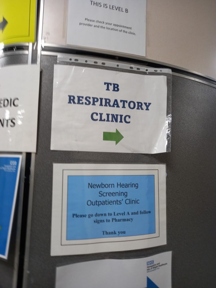 Signs that mention tb clinic and Newborn hearing screening clinic 