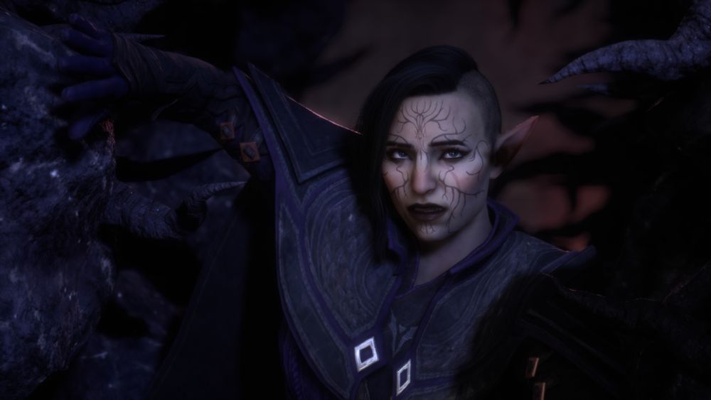An elven woman with the Falon'Din vallaslin and a scar under her left eye pushes through a blight growth.