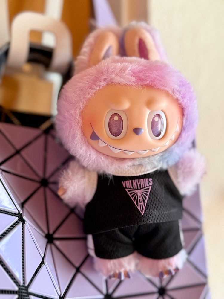 Purple Labubu dressed in a black Golden State Valkyries uniform. 