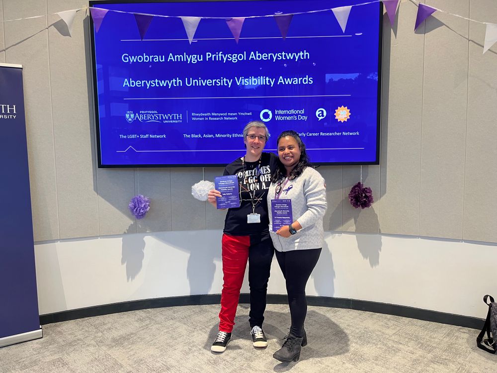 Tally Roberts and Praboda Rajapaksha receiving their Aberystwyth University Visibility Awards 