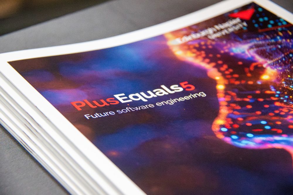 Close up pf PlusEquals5 conference programme.