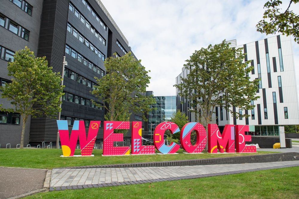Large letters spelling out "WELCOME" in front of the Edinburgh Napier University's Sighthill campus.