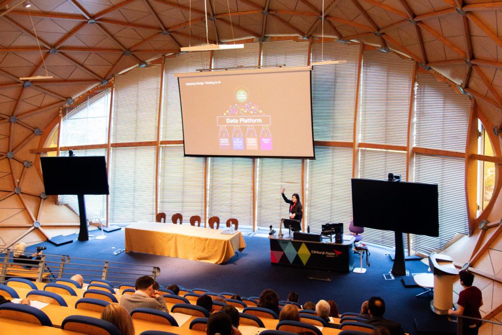 Lucy Batley presenting at the PlusEquals5 conference.