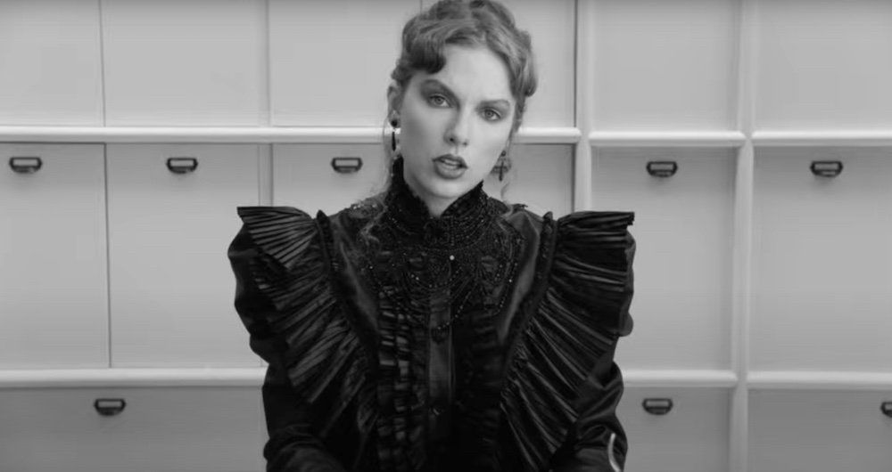Taylor Swift in the Fortnight music video wearing a black dress